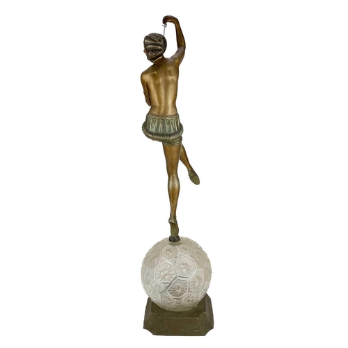 199 - A French Art Deco table lamp. With a bronzed spelter female dancer holding a marionette of Pierrot s... 