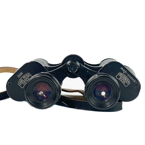 203 - A pair of Zeiss 8 X 30 binoculars. In leather carry case.