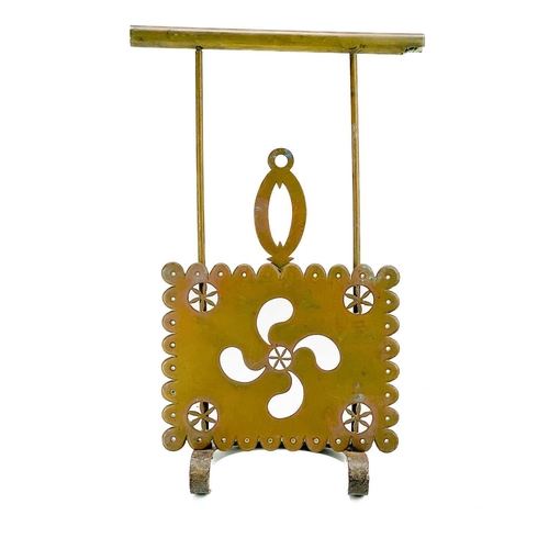 204 - A Victorian brass sliding trivet. With heavy foliate pierced stand, length 49cm.