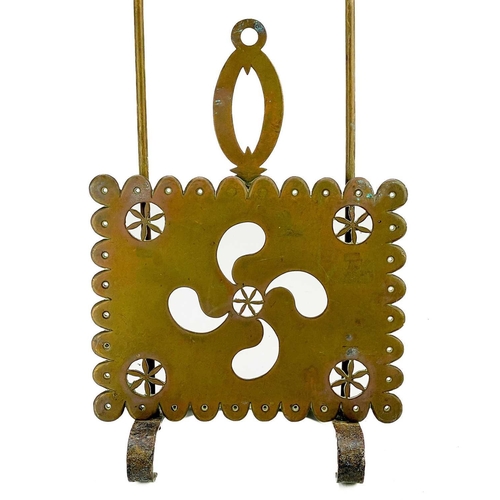 204 - A Victorian brass sliding trivet. With heavy foliate pierced stand, length 49cm.