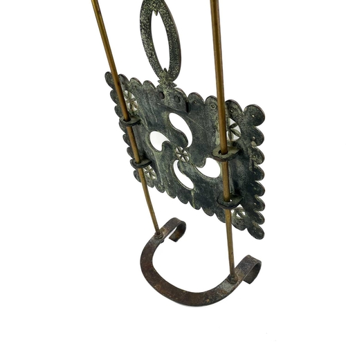 204 - A Victorian brass sliding trivet. With heavy foliate pierced stand, length 49cm.