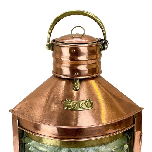 207 - A copper and brass mast lamp. PORT, height 50cm width 36cm.