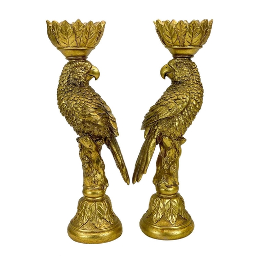 215 - A pair of gold painted candle stick holders modelled as parrots. Height 33.5cm.