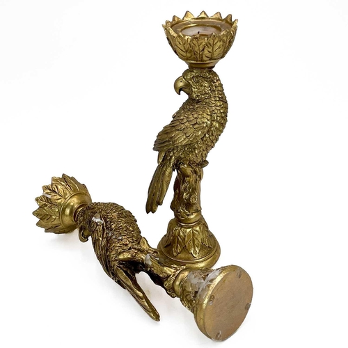 215 - A pair of gold painted candle stick holders modelled as parrots. Height 33.5cm.