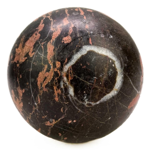 22 - A Torquay Devon turned marble sphere. Late Victorian, diameter 11cm, on a mahogany stand. There is a... 