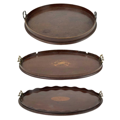 221 - A 19th century circular mahogany tray. With twin brass handles, diameter 47cm, together with two mah... 