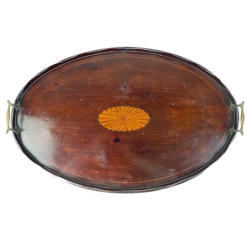 221 - A 19th century circular mahogany tray. With twin brass handles, diameter 47cm, together with two mah... 