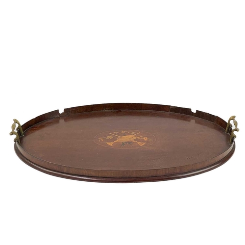 221 - A 19th century circular mahogany tray. With twin brass handles, diameter 47cm, together with two mah... 