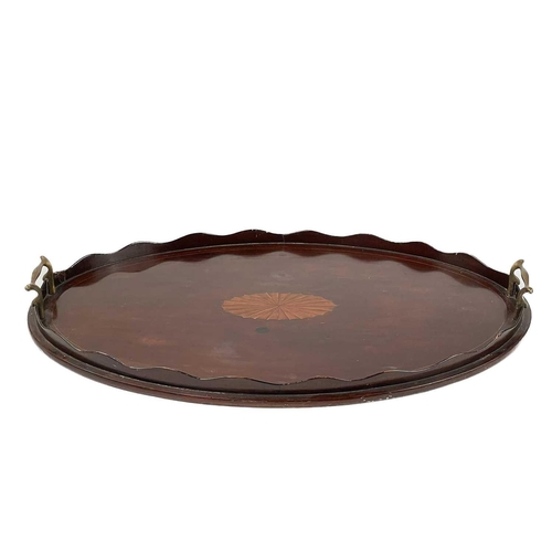 221 - A 19th century circular mahogany tray. With twin brass handles, diameter 47cm, together with two mah... 