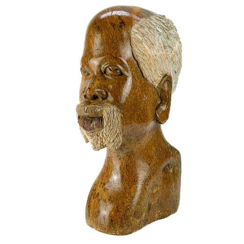 226 - A large African Shona stone bust. Height 41cm.