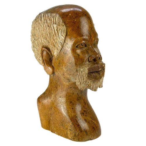 226 - A large African Shona stone bust. Height 41cm.