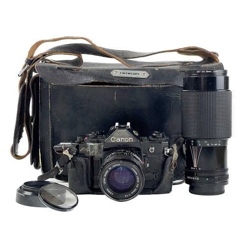 231 - A Canon A1 SLR camera. Serial Number 1450544, fitted with a Canon FD 50mm serial number 2583407 lens... 