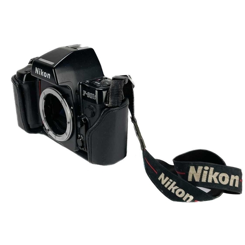 234 - A Nikon F90X SLR camera. Fitted with an AF NIKKOR 70-210mm lens together with an MB-10 Vertical Grip... 