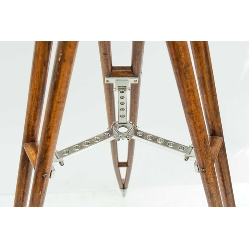 235 - A ship's cargo deck light on a tripod stand. White painted, with a metal grille, the stained beech t... 