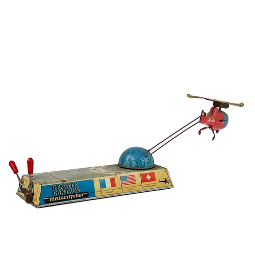 240 - A tin toy clockwork Remote Control Helicopter by Billers circa 1960. length 21.5cm.