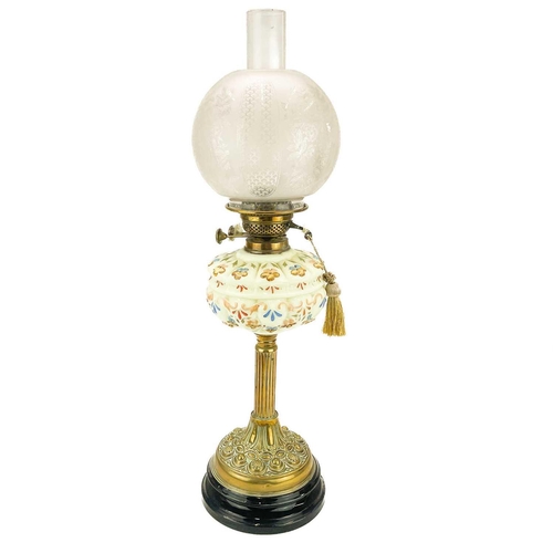 247 - A Victorian brass oil lamp with etched glass shade. On a circular base, with a moulded and painted g... 