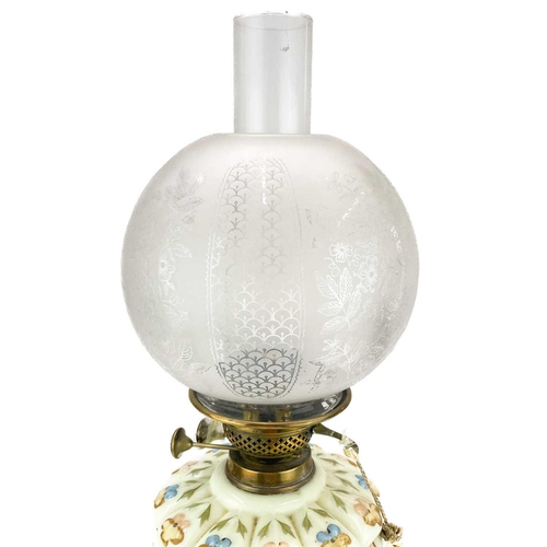 247 - A Victorian brass oil lamp with etched glass shade. On a circular base, with a moulded and painted g... 