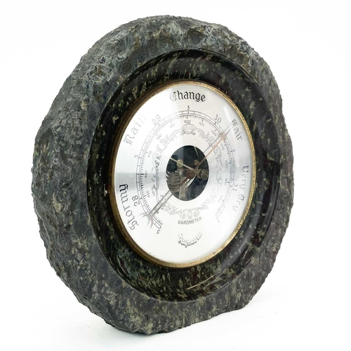 255 - A small collection of Cornish serpentine. Comprising a clock case, diameter 15cm, an aneroid baromet... 