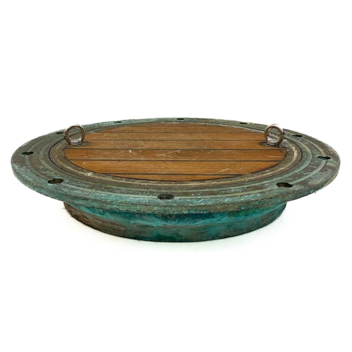 264 - A large bronze porthole. Diameter 62cm.