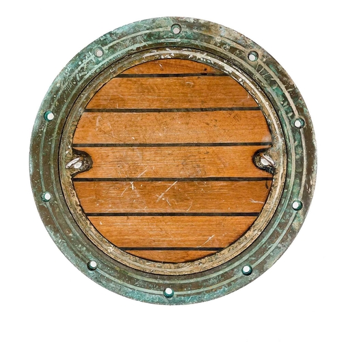 264 - A large bronze porthole. Diameter 62cm.