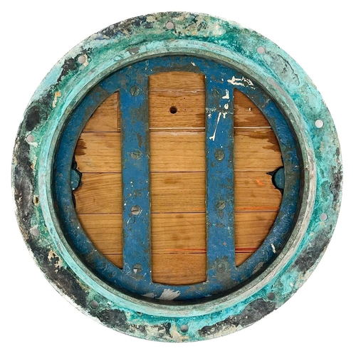 264 - A large bronze porthole. Diameter 62cm.