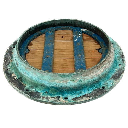 264 - A large bronze porthole. Diameter 62cm.