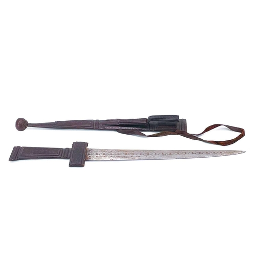 274 - A Tuareg Takouba type short sword. Leather clad and with ball terminal, the sheath fitted an additio... 