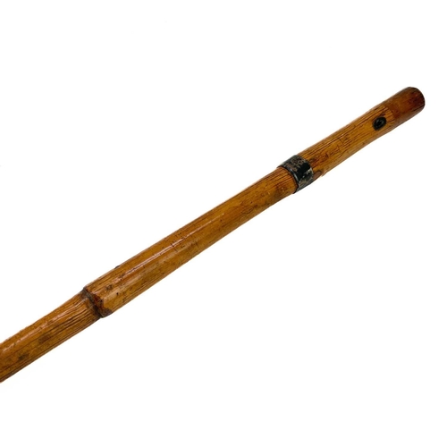 279 - A Bamboo sword stick. 19th century, with a foliate engraved tapered blade, length 94.5cm.