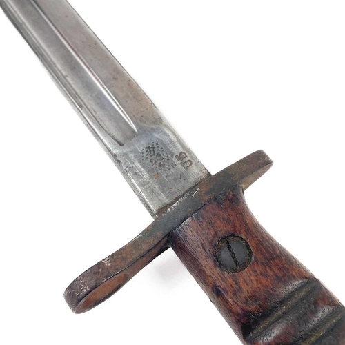 280 - A United States Remington bayonet. Blade marked at base with 1913 - 10 17, the leather case marked H... 