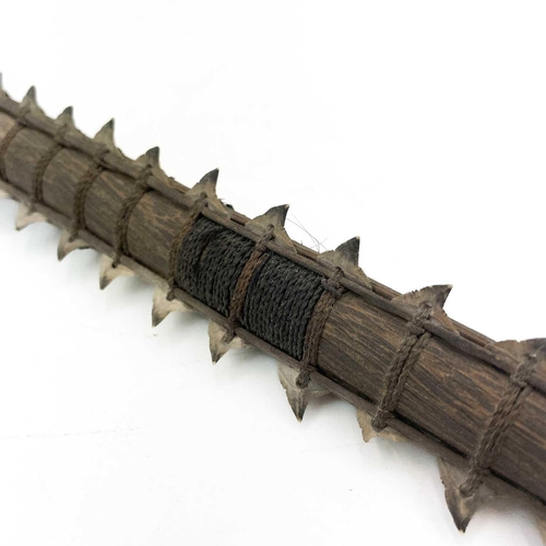 294 - A Kiribati (Gilbert Islands) shark tooth sword. Late 19th/early 20th century, with fibre bound taper... 