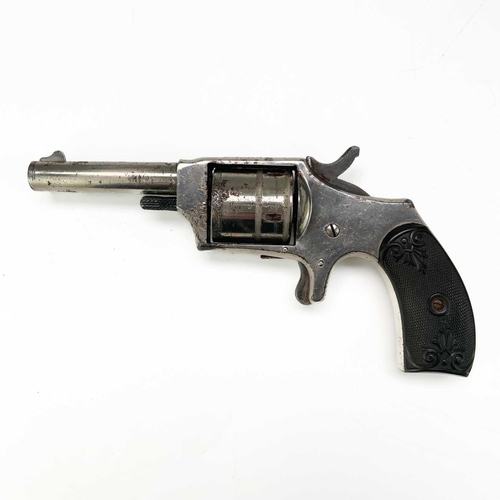 298 - A Hopkins & Allen Dictator rim fire revolver. With chequered and scroll decorated bakelite grip, Len... 