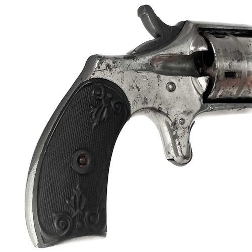 298 - A Hopkins & Allen Dictator rim fire revolver. With chequered and scroll decorated bakelite grip, Len... 