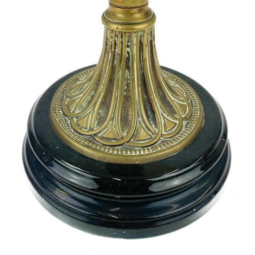 3 - A Victorian brass oil lamp with moulded yellow glass reservoir and etched glass shade. Raised on a c... 