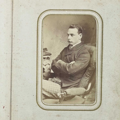 301 - CRICKET INTEREST: A Victorian brass clasped photograph album. Containing photographs of a Victorian ... 