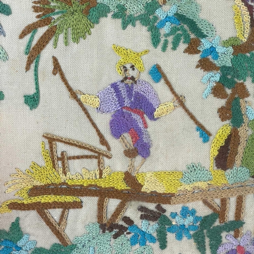 312 - A woolwork Chinoiserie picture. Early 20th century, worked with two figures watching a performer in ... 