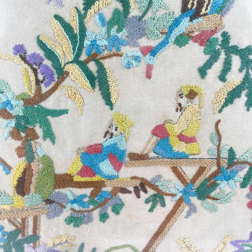 312 - A woolwork Chinoiserie picture. Early 20th century, worked with two figures watching a performer in ... 