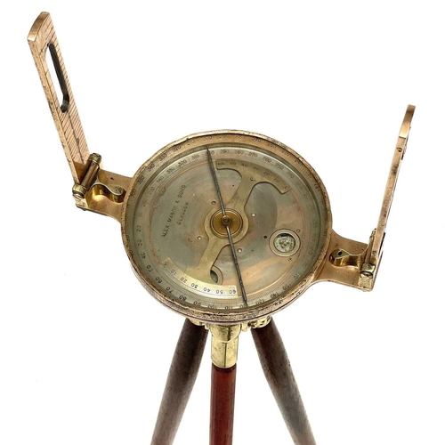 317 - A brass miners dial by Alex Mabon & Co. On tripod stand, dial diameter 17cm.