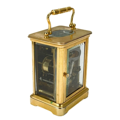 322 - A French brass carriage clock circa 1900. White enamel alarm dial and bell fitted to base, height 11... 