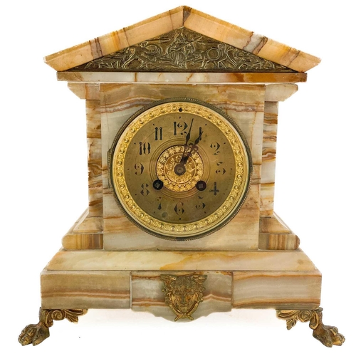 323 - A French onyx cased mantel clock. 19th century, the case of architectural form with applied brass mo... 