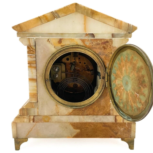 323 - A French onyx cased mantel clock. 19th century, the case of architectural form with applied brass mo... 