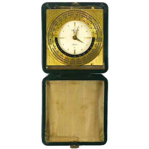 324 - A Swiss Worldwide travel alarm clock by Luxor for Asprey. With gilt adjustable dial, in a green leat... 