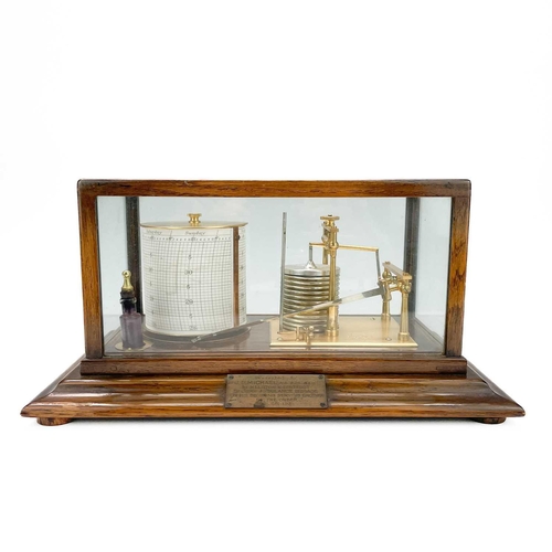 325 - A 20th century barograph by Short & Mason London. In a glazed oak case and brass presentation plaque... 