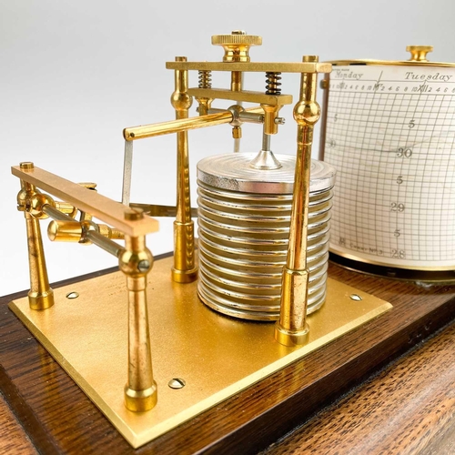 325 - A 20th century barograph by Short & Mason London. In a glazed oak case and brass presentation plaque... 