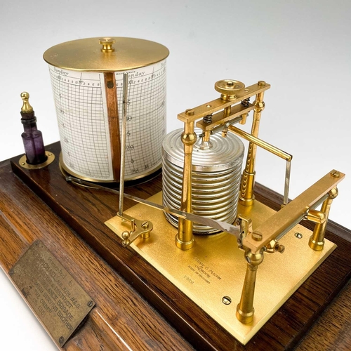 325 - A 20th century barograph by Short & Mason London. In a glazed oak case and brass presentation plaque... 