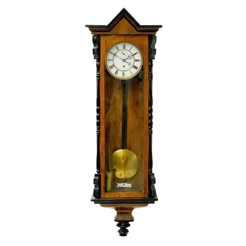 331 - A Vienna regulator type walnut wall clock. Late 19th century, with ebonised mouldings and architectu... 