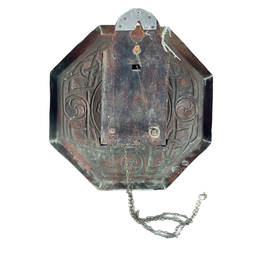 336 - An Arts and Crafts repousse decorated brass faced wall clock. With Arabic numerals and broad Celtic ... 