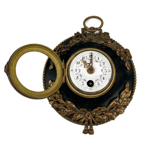 337 - A 19th century French gilt metal black enamel circular wall clock. With an enamel face with Arabic n... 