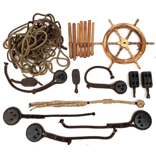 34 - A large collection of reproduction maritime items Including cat 'o' nine tails, rope, block and tack... 