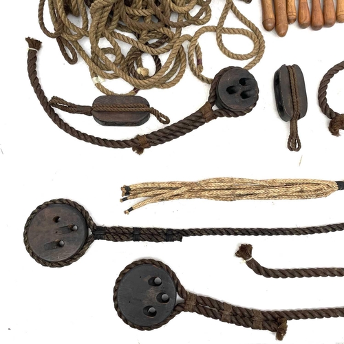 34 - A large collection of reproduction maritime items Including cat 'o' nine tails, rope, block and tack... 