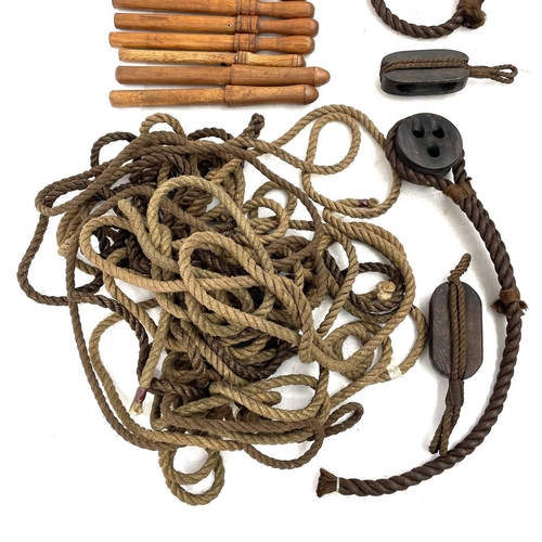 34 - A large collection of reproduction maritime items Including cat 'o' nine tails, rope, block and tack... 